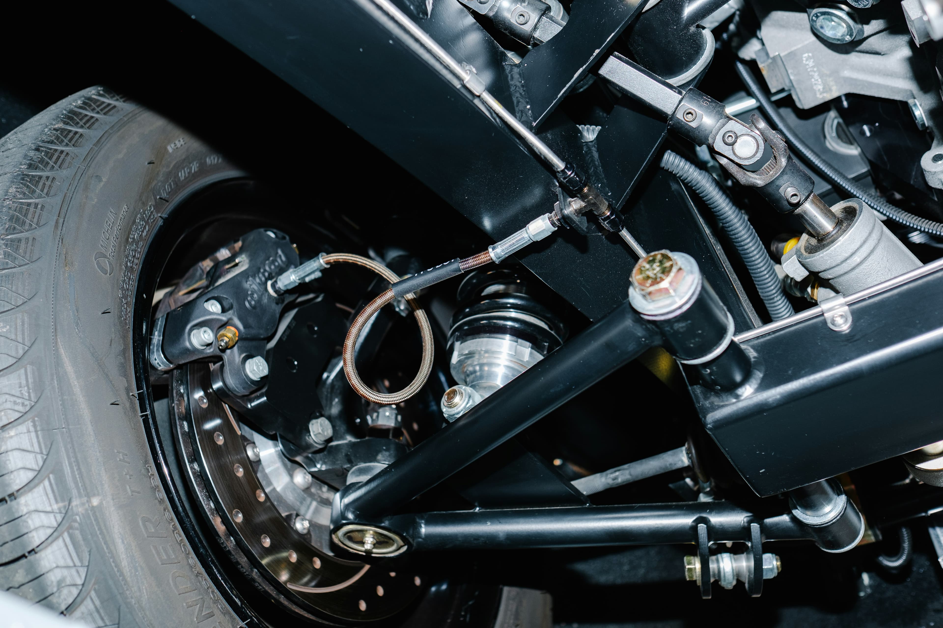 Detailed view of a vehicle's suspension and wheel assembly